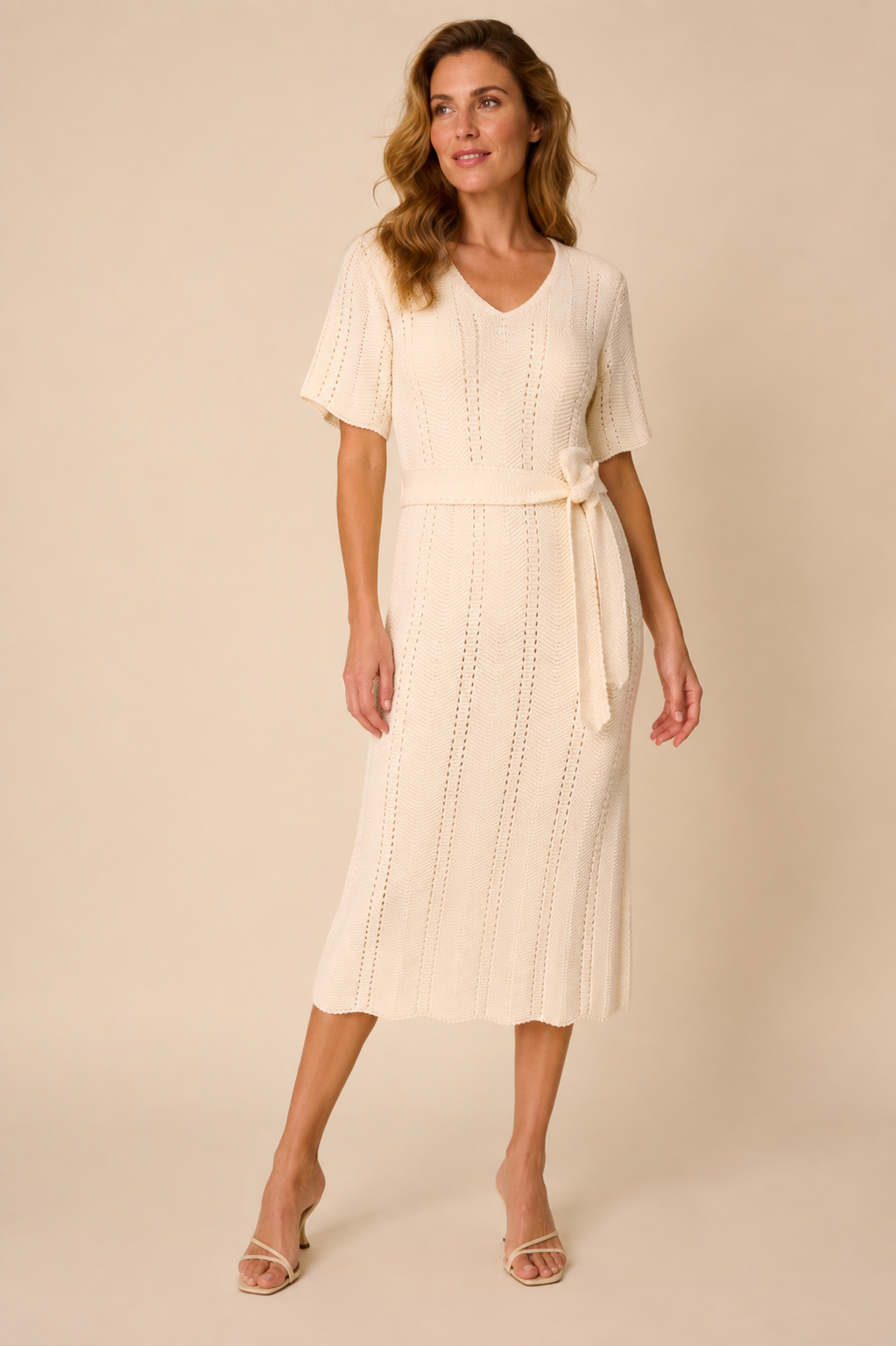 Smashed Lemon knit dress in off white worn by a model, standing — Boetiek, Cape Town