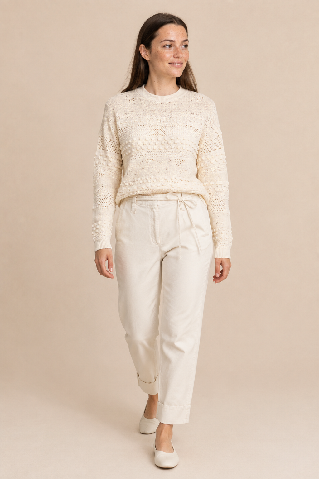 Smashed Lemon knit top in off white worn by a model, in motion — Boetiek, Cape Town