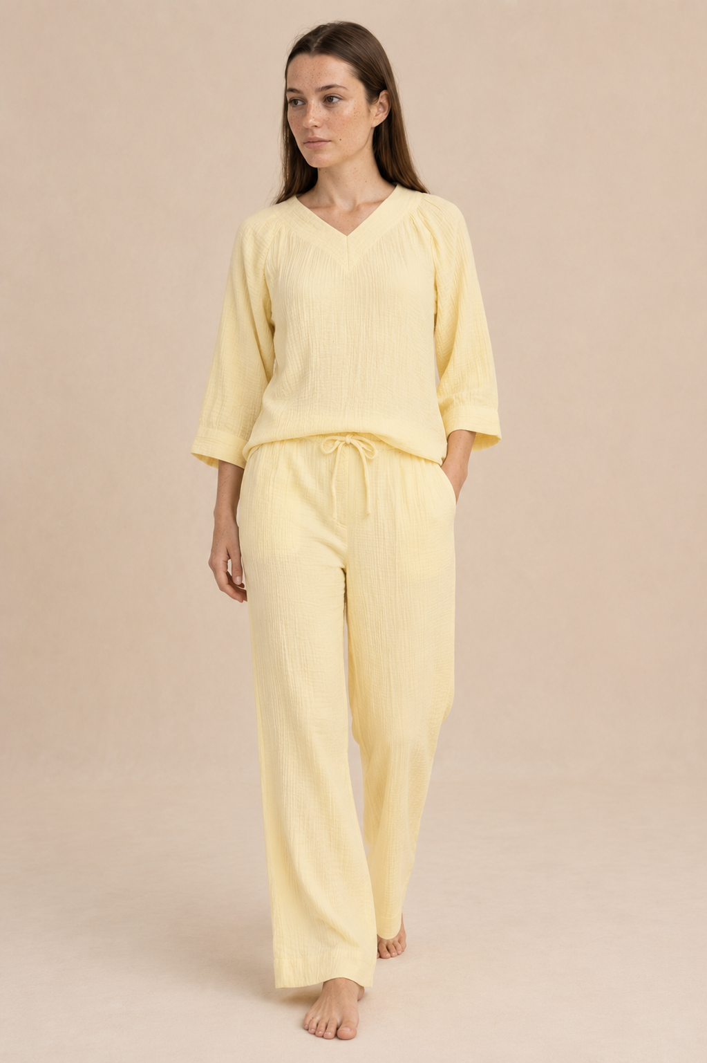 Smashed Lemon light yellow wide leg pants with drawstring waist and relaxed silhouette, styled on model.