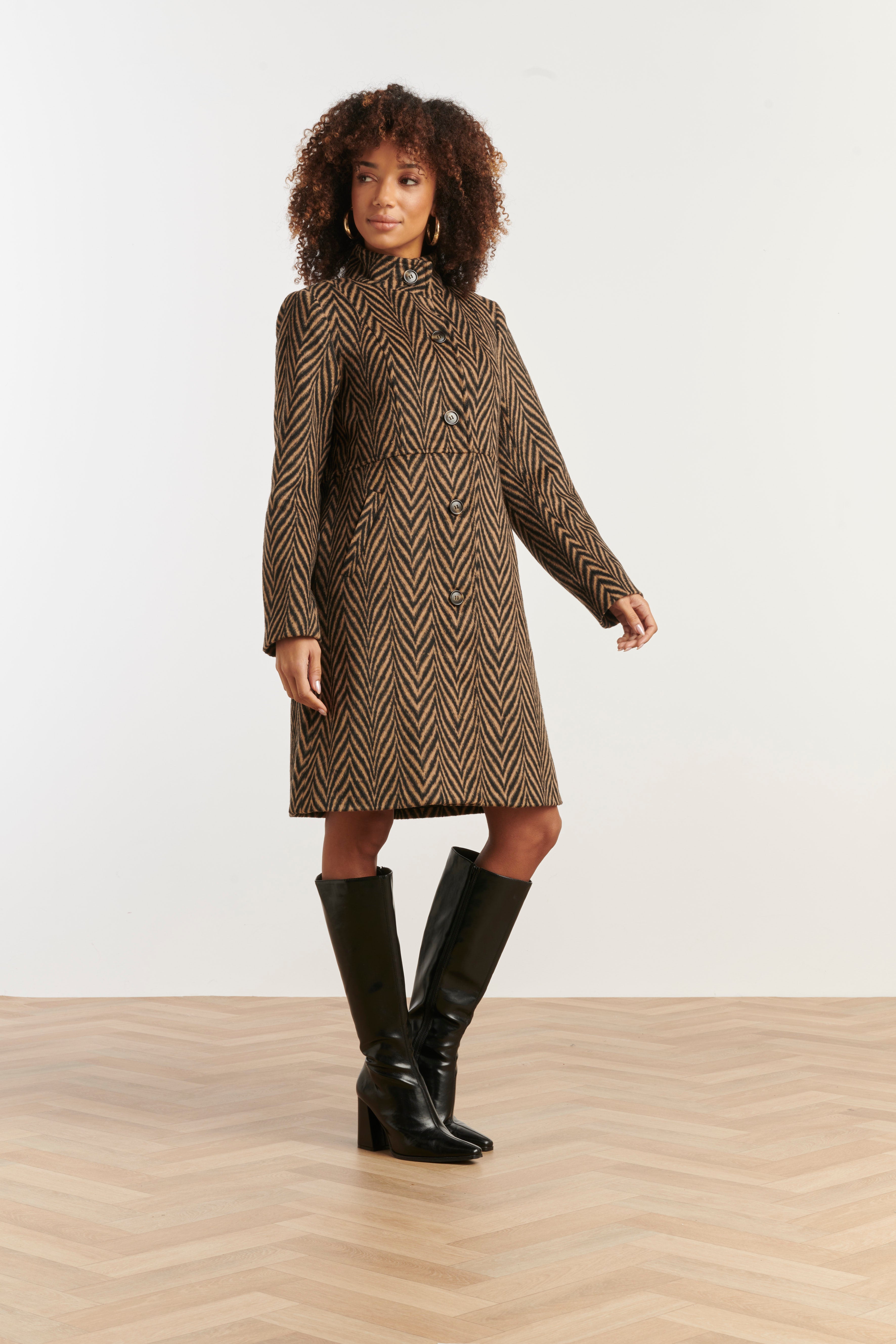 Smashed Lemon printed coat in black and camel chevron, knee-length with high collar, three-quarter angle view