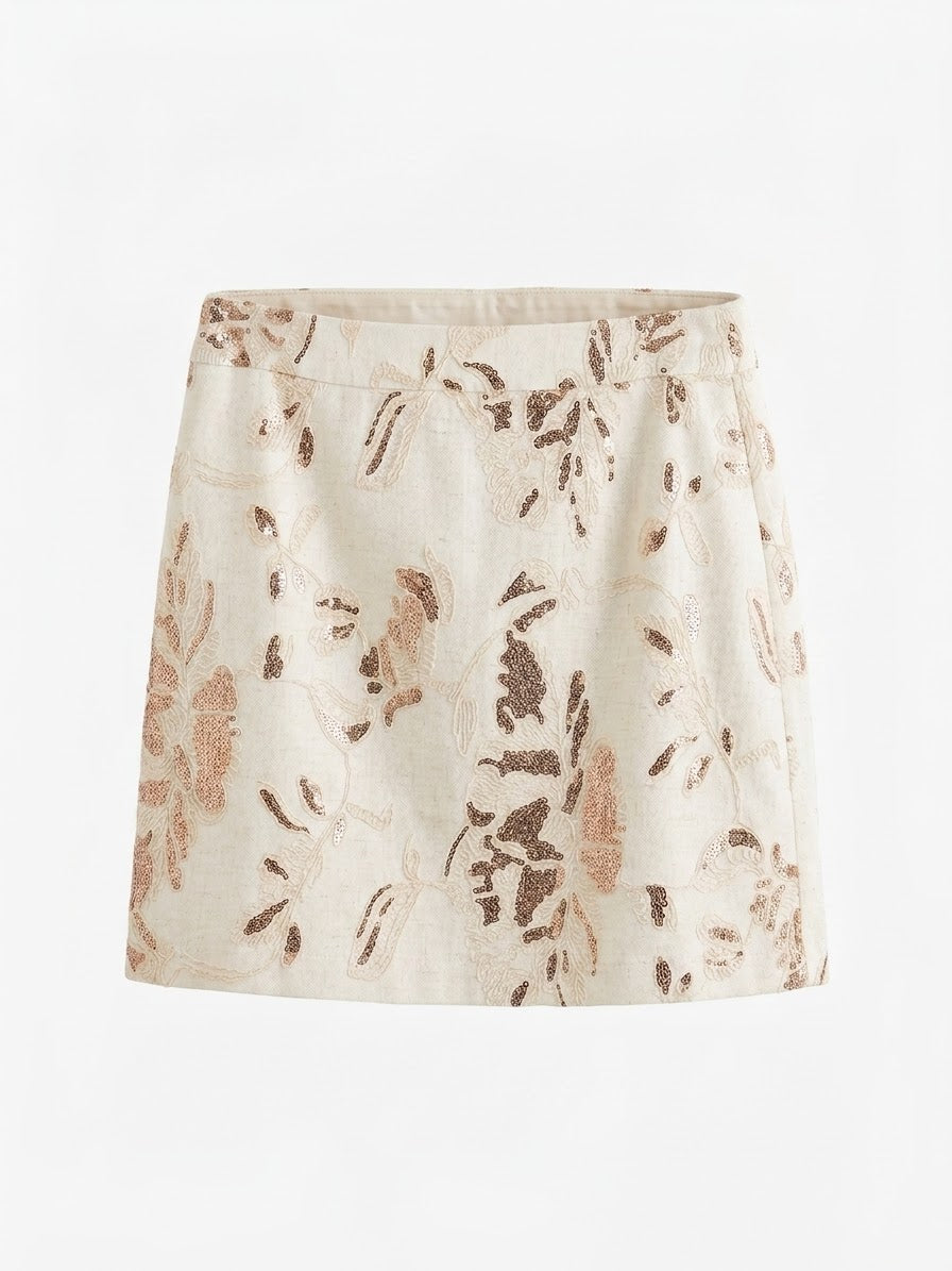 Smashed Lemon printed mini skirt in sand and copper front view with shimmering sequin floral detail
