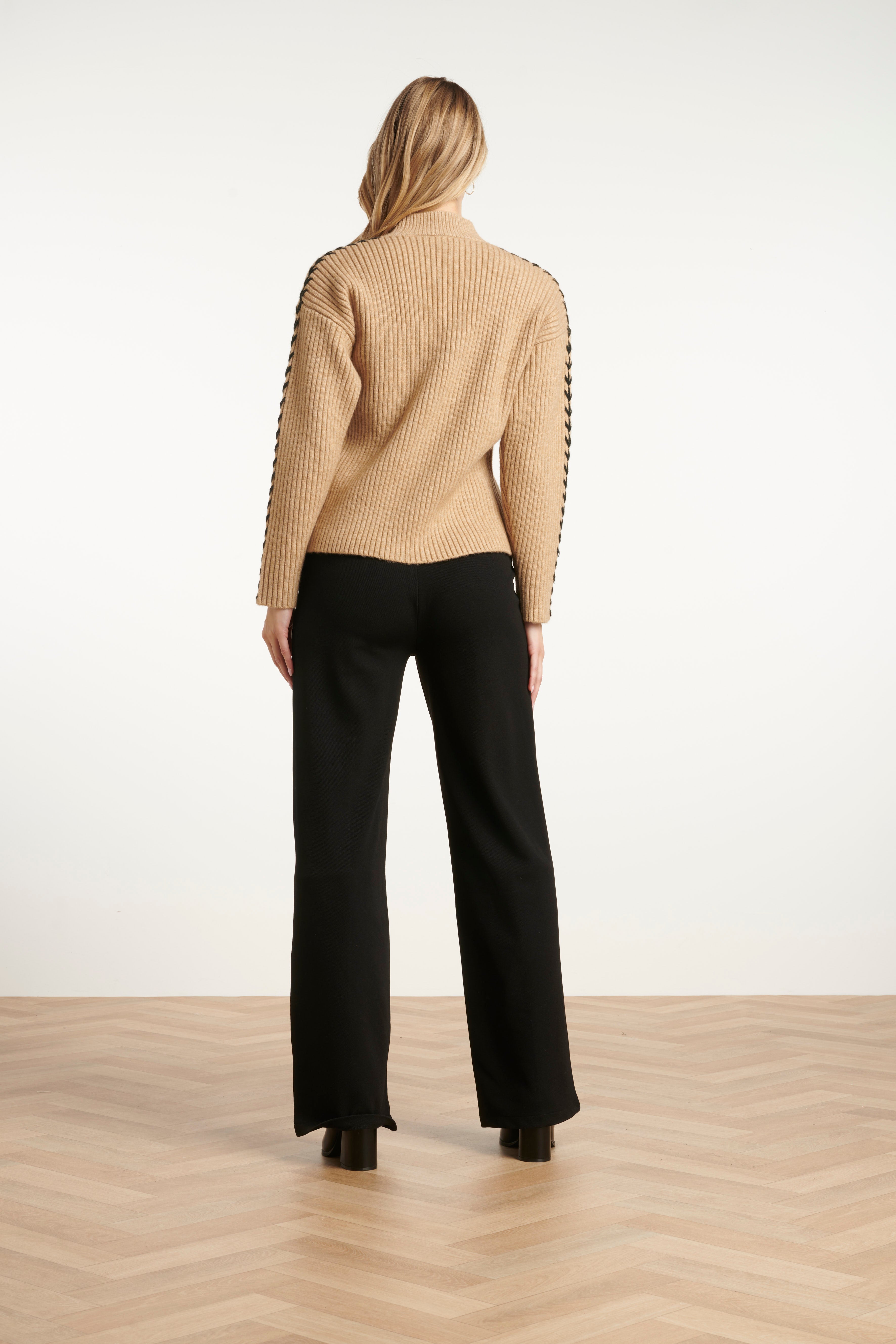Smashed Lemon ribbed knit top in camel with black whipstitch contrast detailing, high neckline and long sleeves, back view