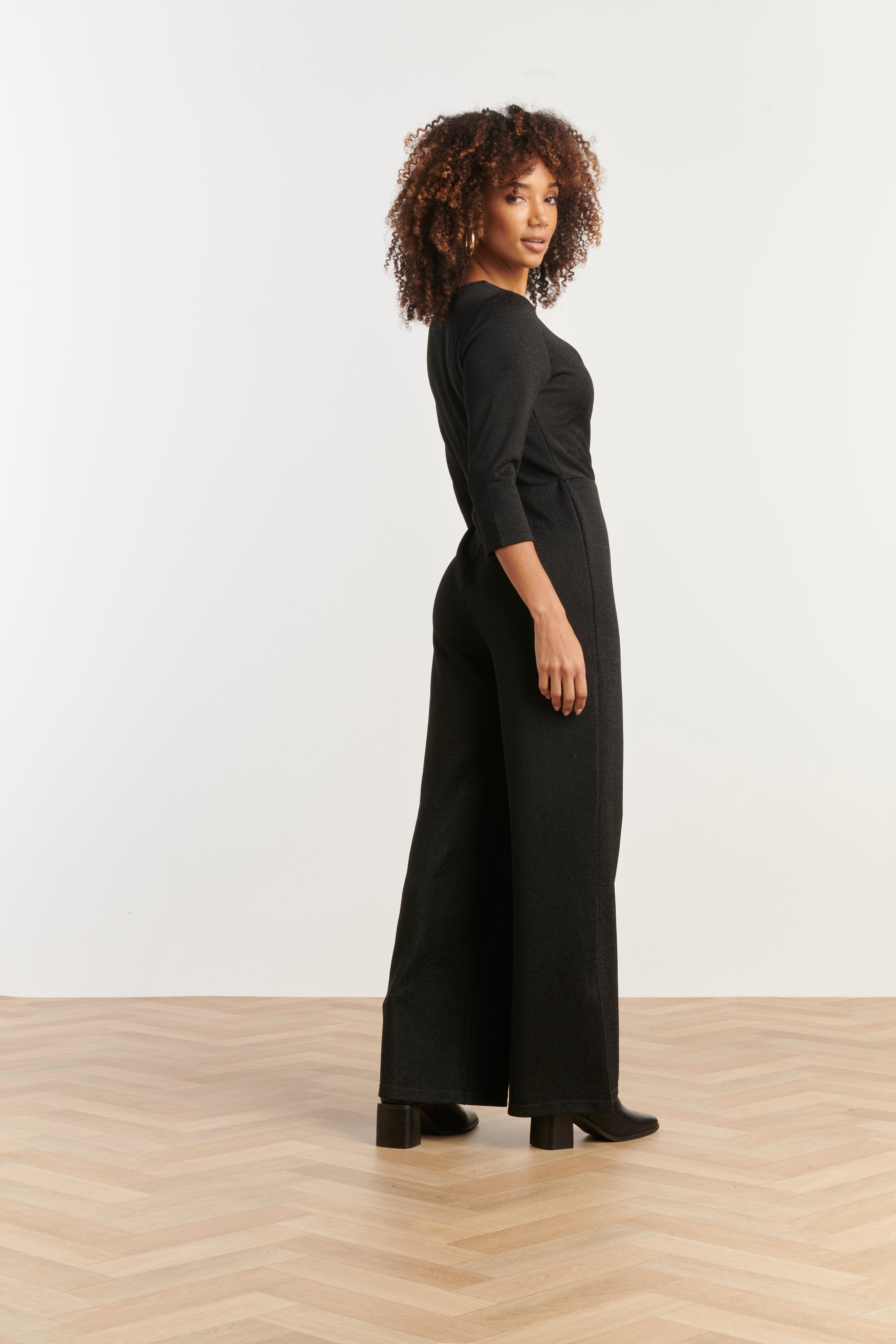 Smashed Lemon wrap jumpsuit in black with three-quarter sleeves and wide leg, side view