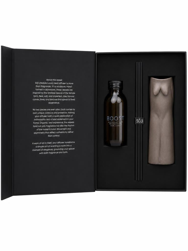 SŌJI Diffuser Boost reed diffuser set featuring fragrance oil, black reeds and a sculptural taupe diffuser vessel presented in a luxury gift box.