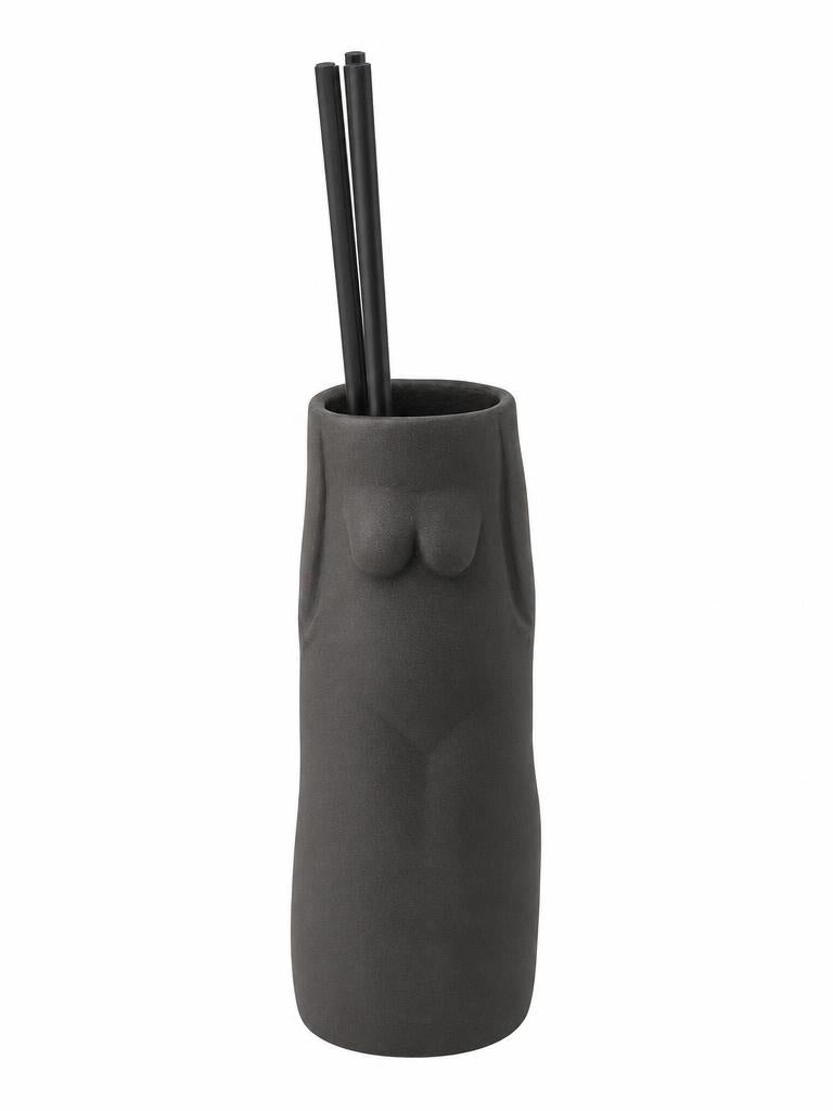 SŌJI Oasis reed diffuser featuring fragrance oil, black reeds and a handcrafted sculptural stoneware vessel presented in a luxury gift box.