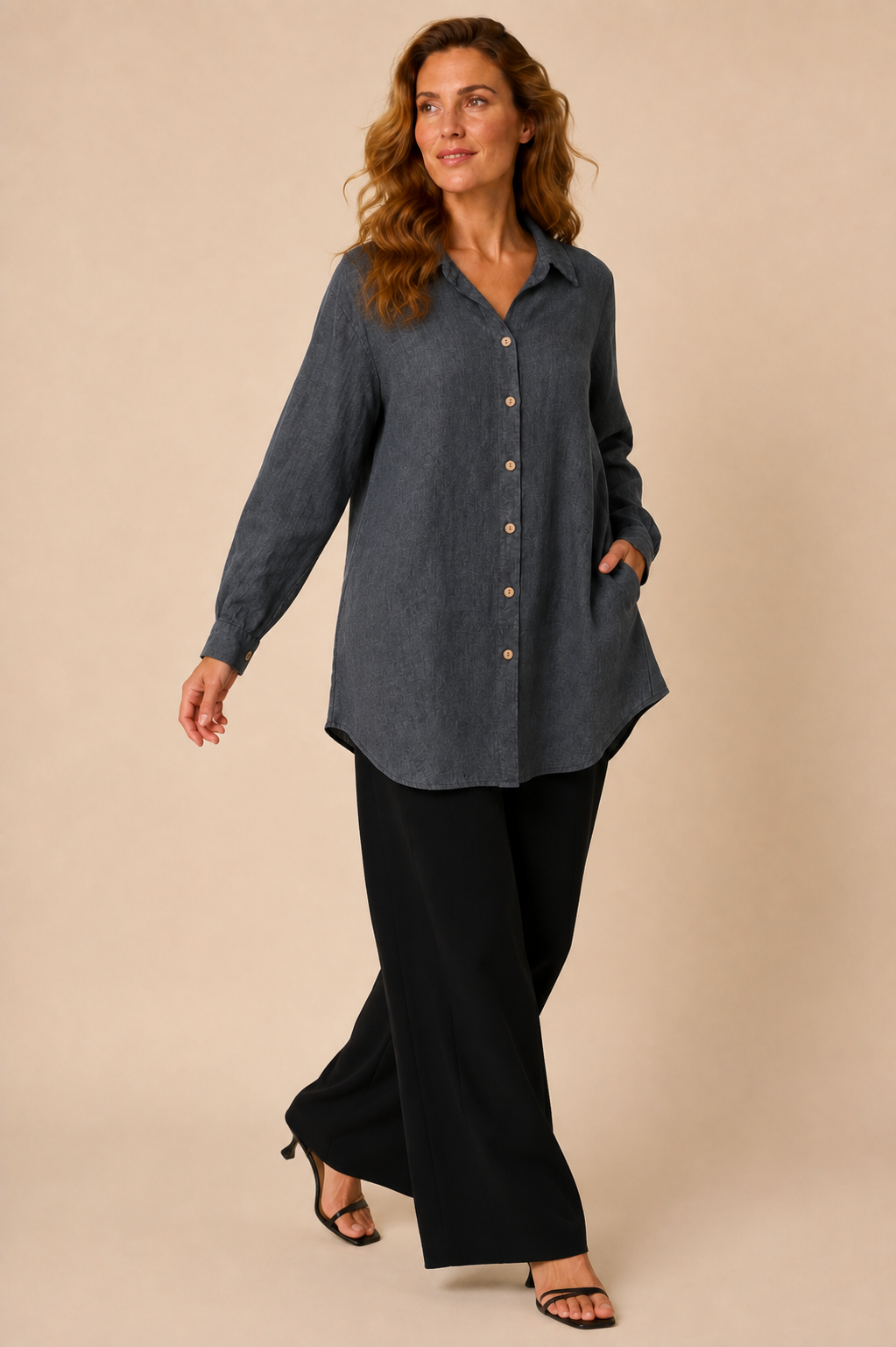 Suzy D Soraya linen long shirt with side pockets in anthracite worn by a model, in motion — Boetiek, Cape Town