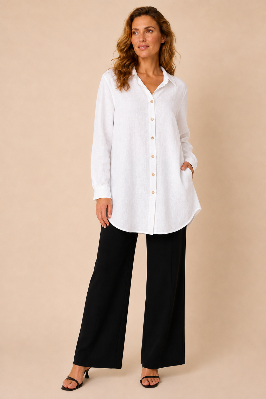 Suzy D Soraya linen long shirt in white worn by a model, standing — Boetiek, Cape Town