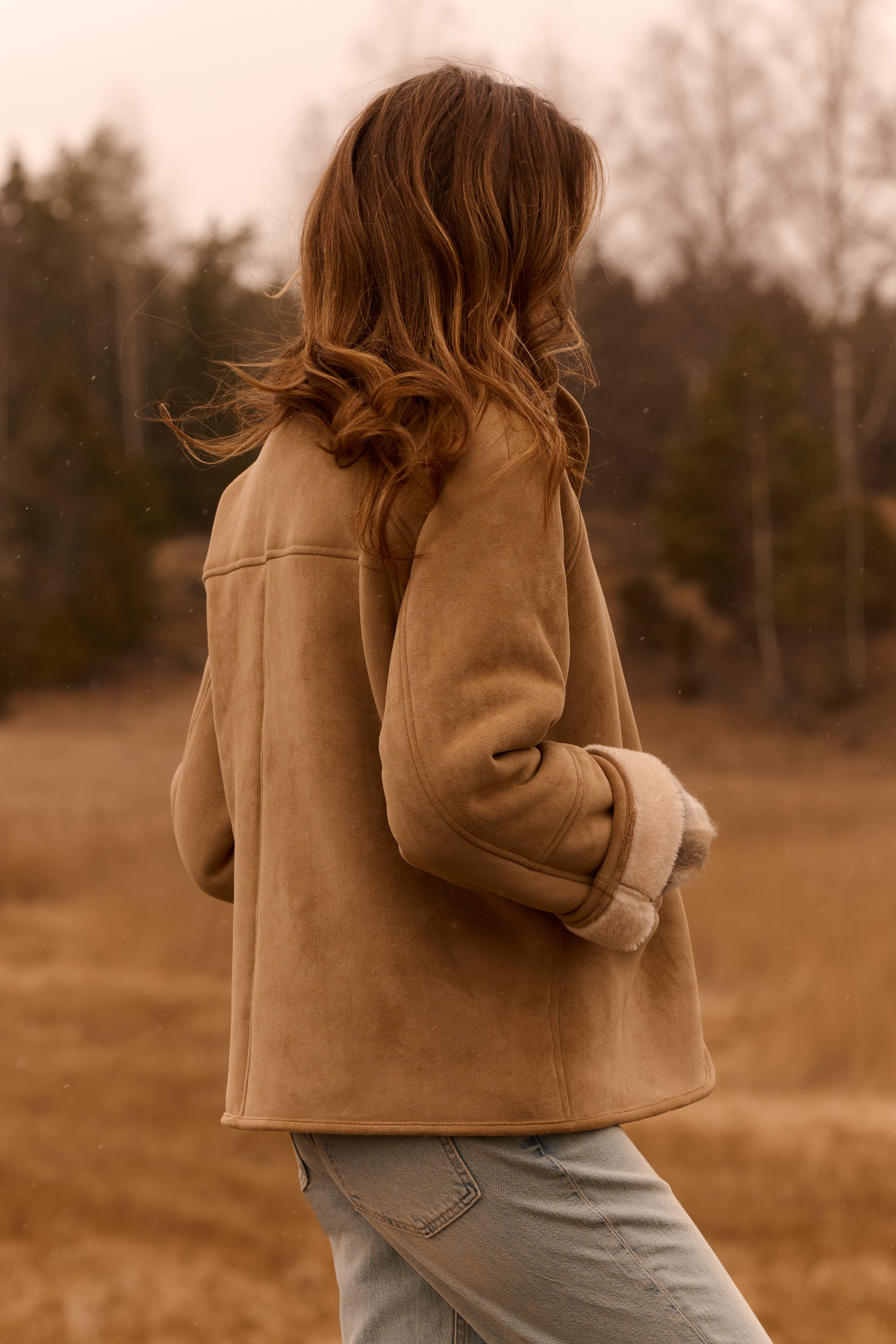 Back view of the YAYA Faux Lammy Coat with Raglan Sleeves in sand showcasing the relaxed silhouette, raglan sleeves and soft faux suede finish.