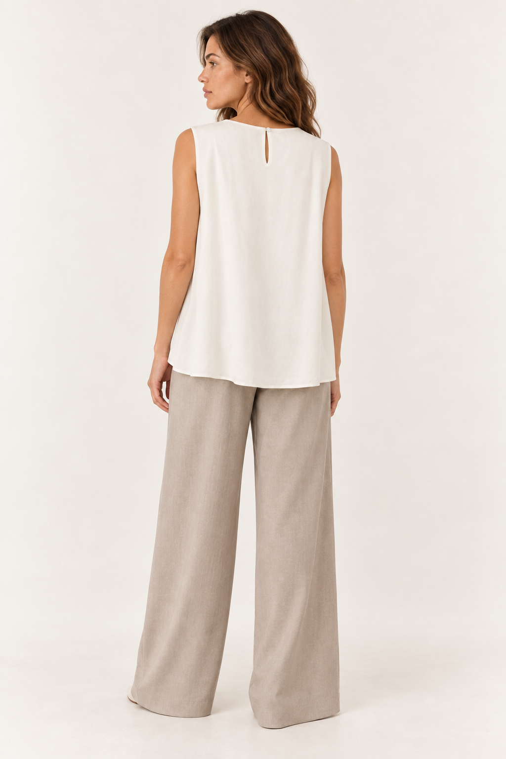 Model wearing the YAYA Balloon Hem Top with Button Back in Cloud Creme White, back view showing the keyhole and button #Colour_Cloud Creme White