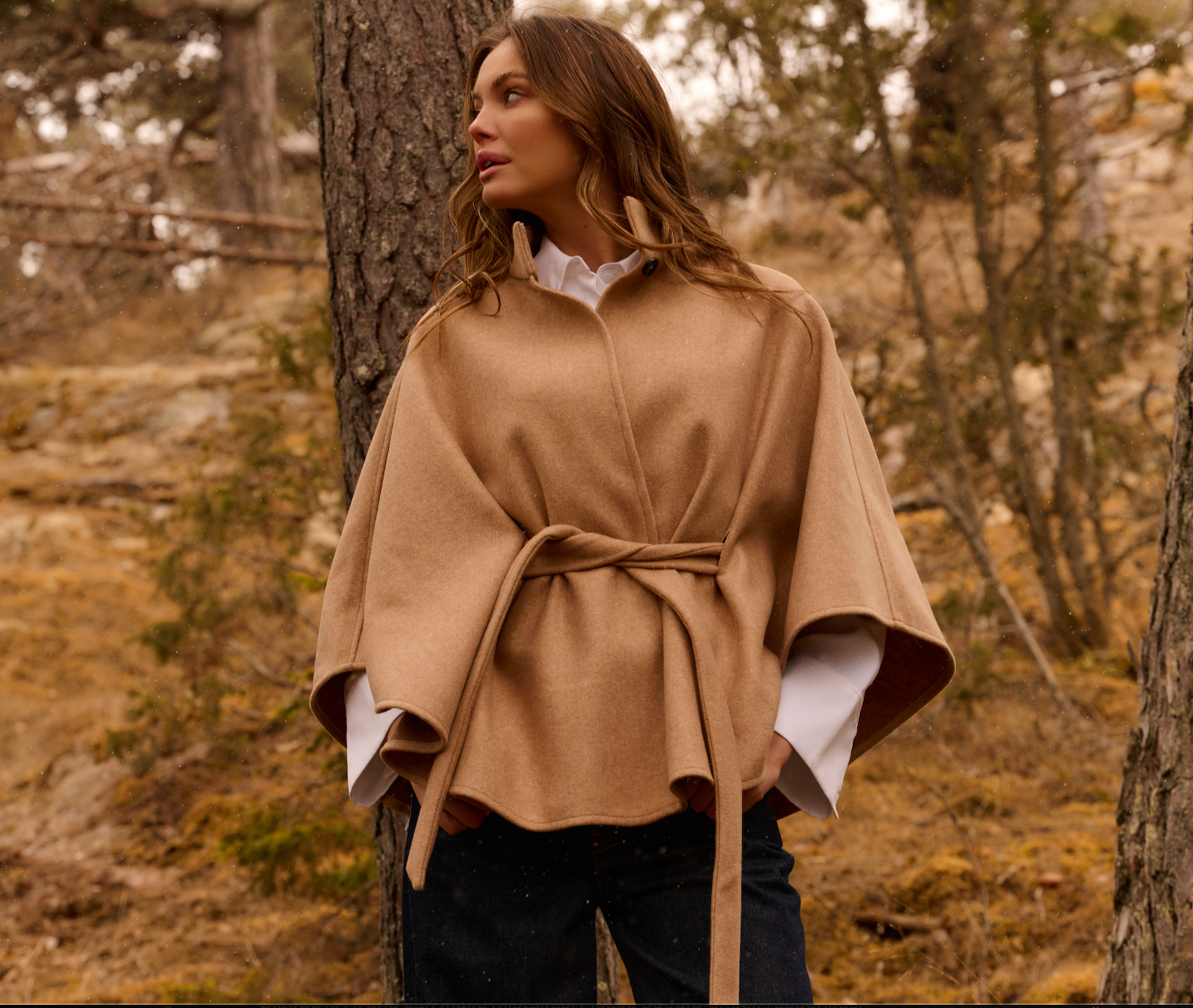 Front view of the YAYA Soft Woven Poncho with Collar & Belt in camel featuring a high collar, waist tie belt and relaxed cape silhouette.