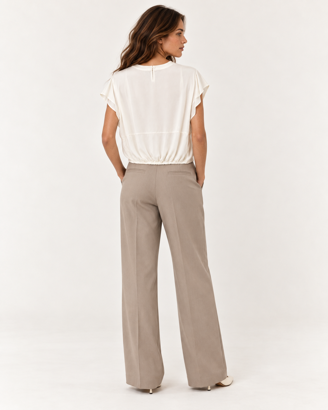 Model wearing the YAYA Knot Hem Top in Ivory White, back view with the button fastening at the centre back neck #Colour_Ivory White