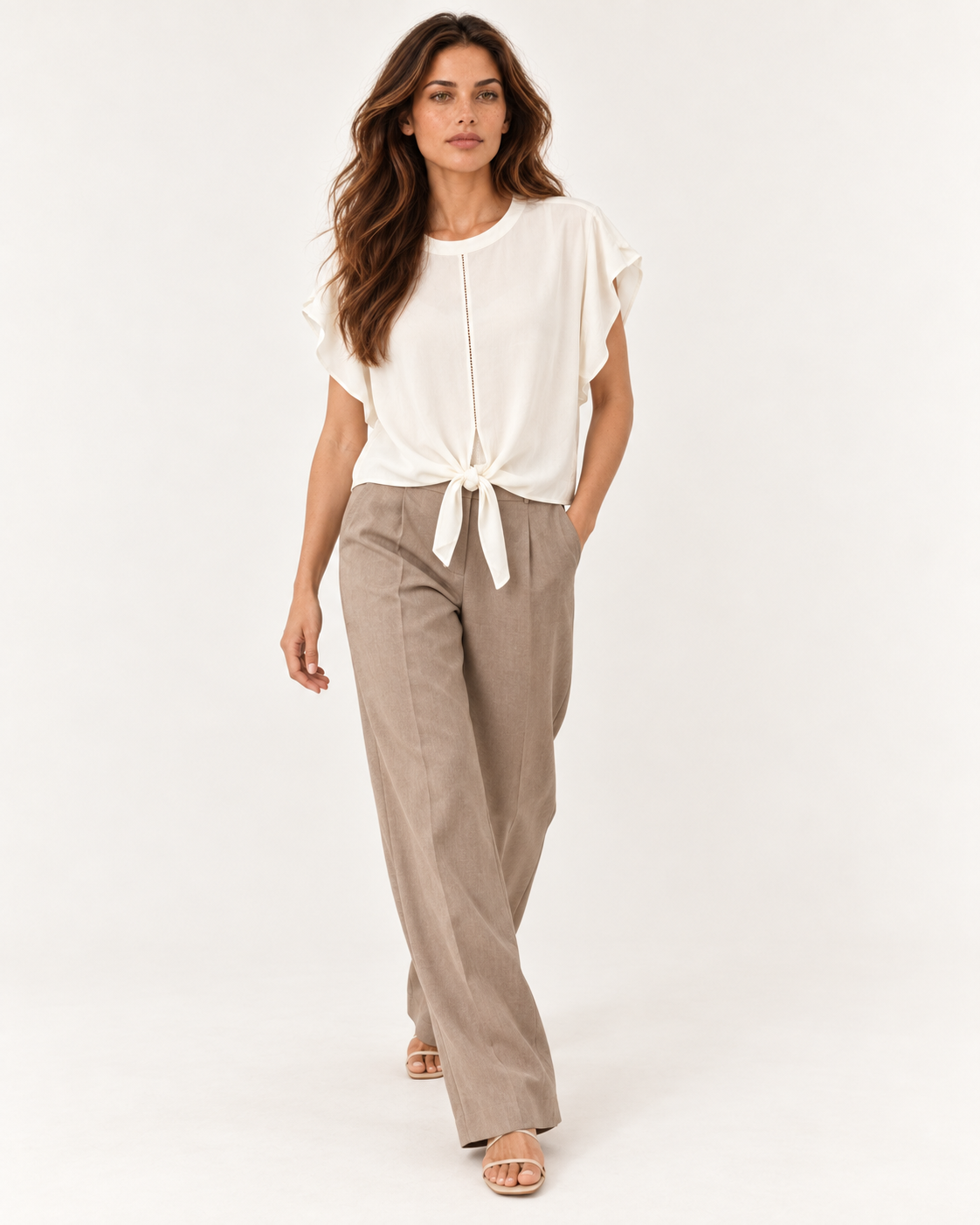 Model walking in the YAYA Knot Hem Top in Ivory White, the viscose moving with the short wide sleeves #Colour_Ivory White